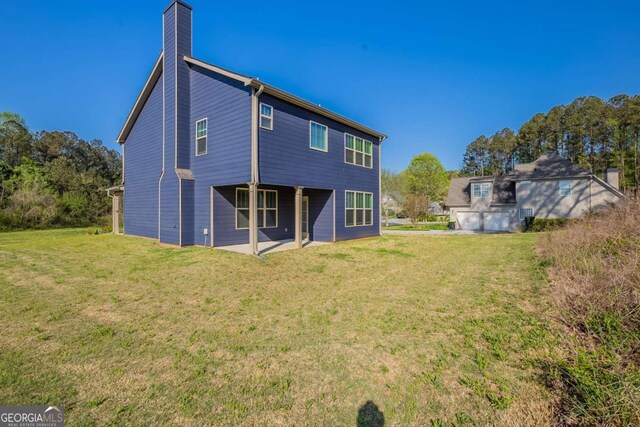 417 Flowery Branch Ct, Villa Rica, GA 30180 - rear view of house with a yard and a chimney