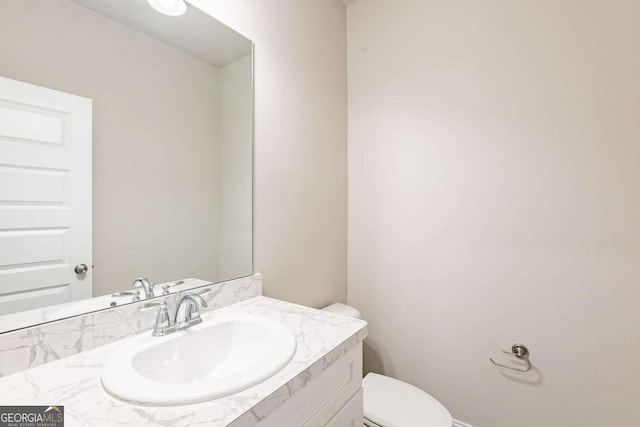 417 Flowery Branch Ct, Villa Rica, GA 30180 - half bathroom featuring vanity and toilet