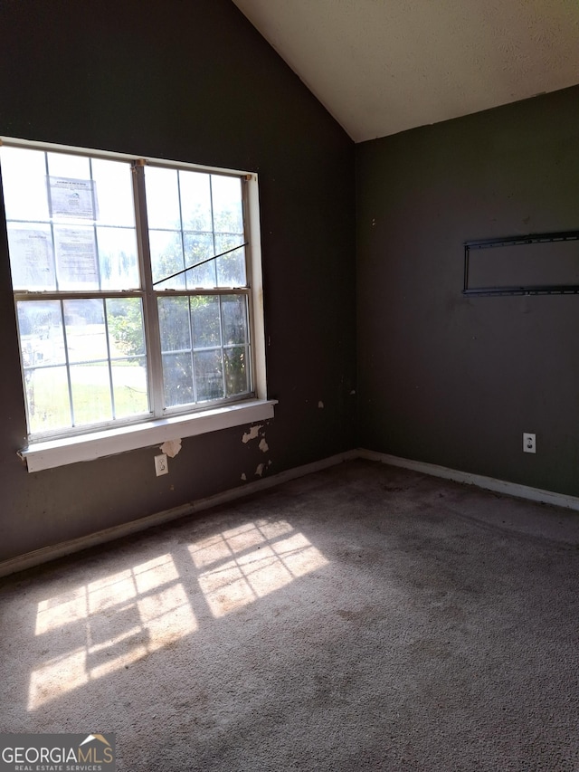 172 Willow Springs Ln, Stockbridge, GA 30281 - carpeted empty room featuring vaulted ceiling and baseboards