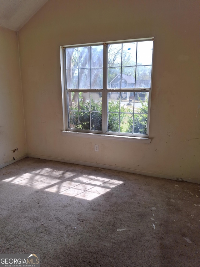 172 Willow Springs Ln, Stockbridge, GA 30281 - carpeted spare room featuring vaulted ceiling