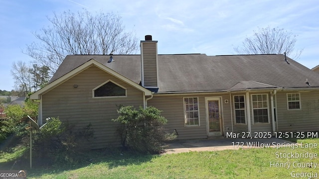 172 Willow Springs Ln, Stockbridge, GA 30281 - back of house with a chimney, a lawn, and a patio