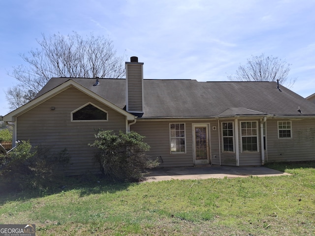 172 Willow Springs Ln, Stockbridge, GA 30281 - rear view of house with a patio area, a chimney, and a lawn