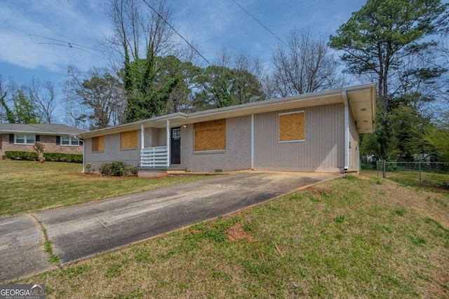 4094 E Glade Ct, Decatur, GA 30035 - ranch-style house with a front lawn, fence, and concrete driveway