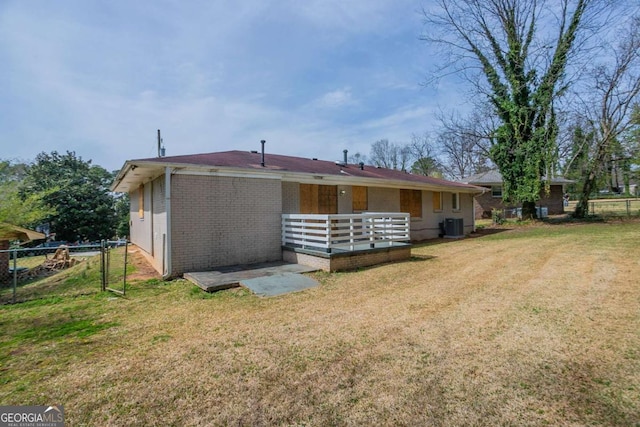 4094 E Glade Ct, Decatur, GA 30035 - rear view of house with brick siding, fence, and a yard