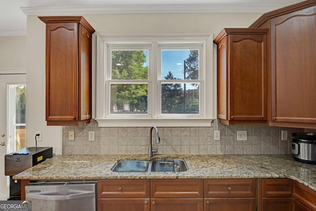 5177 Cabot Creek Dr, Buford, GA 30518 - kitchen featuring dishwasher, backsplash, ornamental molding, light stone countertops, and brown cabinetry