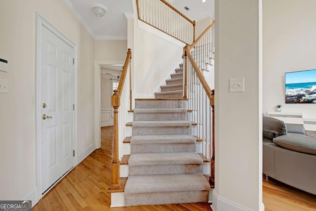 5177 Cabot Creek Dr, Buford, GA 30518 - staircase featuring wood finished floors and crown molding