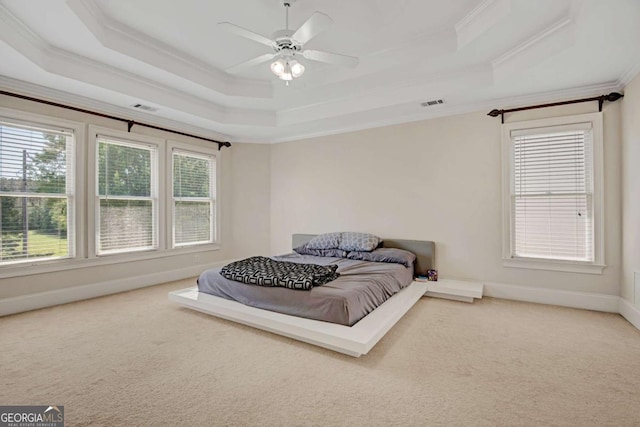 5177 Cabot Creek Dr, Buford, GA 30518 - bedroom featuring a tray ceiling, crown molding, carpet floors, and ceiling fan