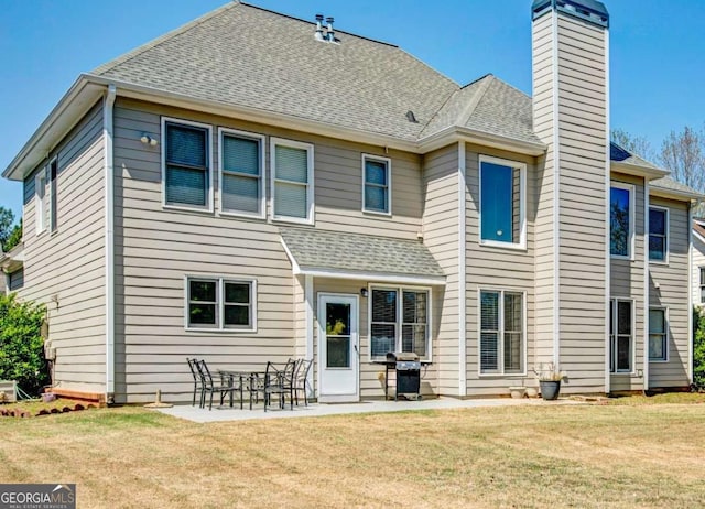 5177 Cabot Creek Dr, Buford, GA 30518 - rear view of house featuring a chimney, roof with shingles, a yard, and a patio