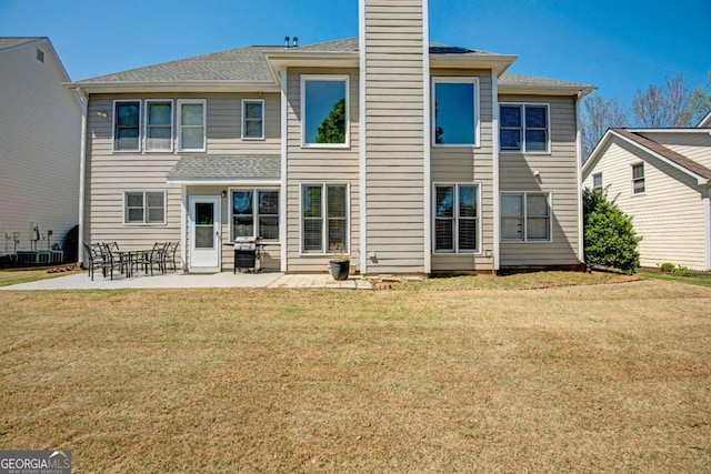 5177 Cabot Creek Dr, Buford, GA 30518 - back of house with a patio, a yard, and a chimney