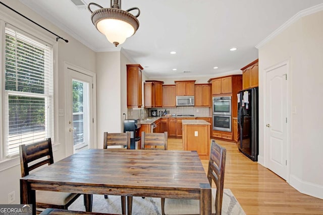 5177 Cabot Creek Dr, Buford, GA 30518 - dining area with light wood-type flooring, crown molding, and recessed lighting