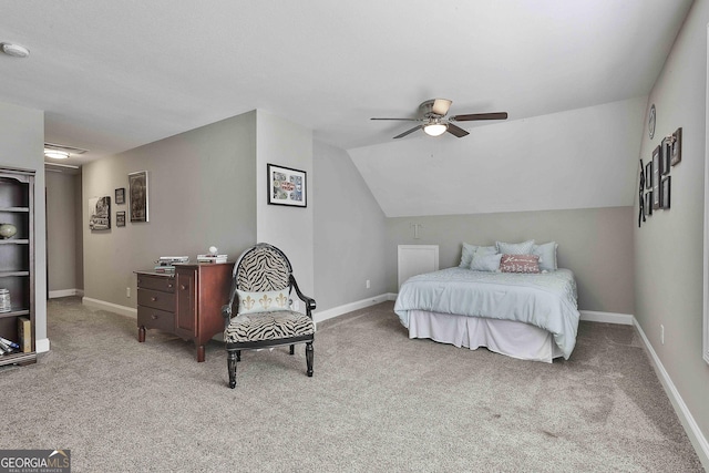 carpeted bedroom with baseboards, a ceiling fan, and vaulted ceiling