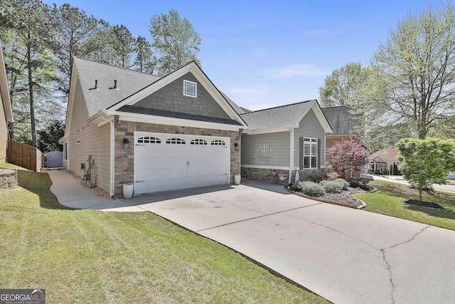 view of front facade with an attached garage, fence, stone siding, and driveway