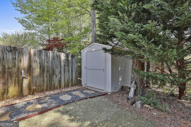view of shed with fence