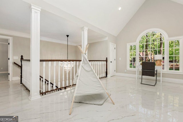 entryway featuring marble tiled flooring, baseboards, a chandelier, decorative columns, and a towering ceiling