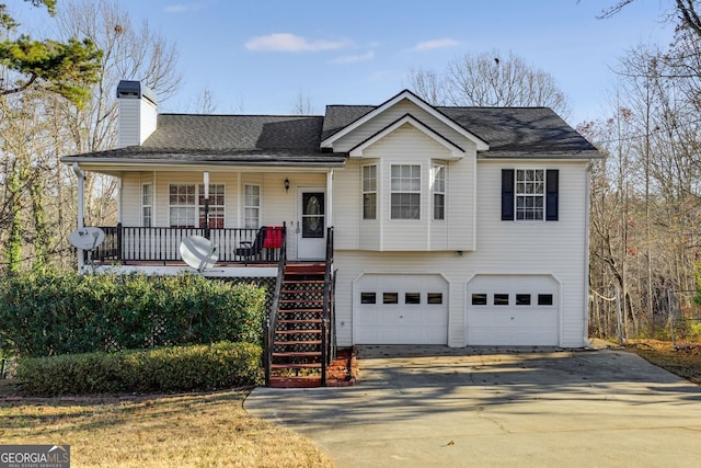 674 Fairview Dr, Dallas, GA 30157 - view of front of house with an attached garage, covered porch, concrete driveway, a chimney, and stairway