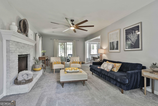 214 Windgate Ct, Peachtree City, GA 30269 - carpeted living area with a ceiling fan and a fireplace