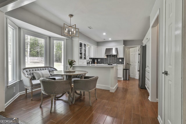 214 Windgate Ct, Peachtree City, GA 30269 - dining room featuring healthy amount of natural light, a chandelier, dark wood-style floors, and recessed lighting