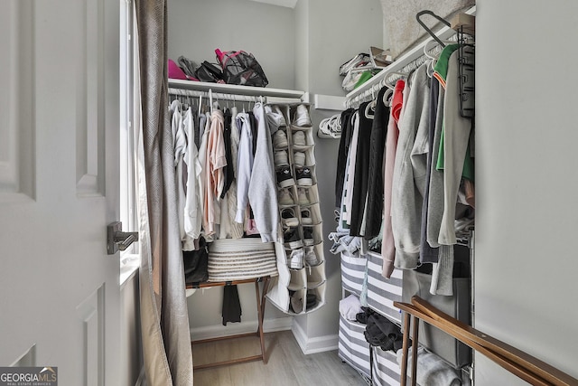 214 Windgate Ct, Peachtree City, GA 30269 - walk in closet featuring wood finished floors