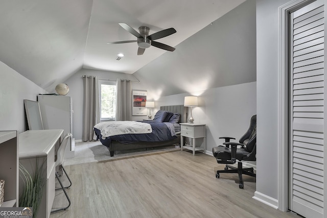 214 Windgate Ct, Peachtree City, GA 30269 - bedroom with vaulted ceiling, light wood finished floors, and an office area