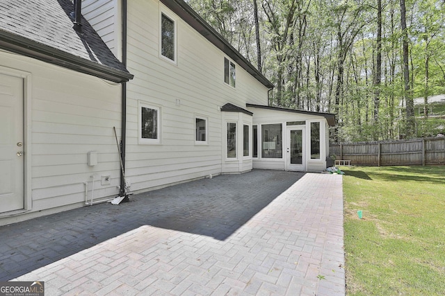 214 Windgate Ct, Peachtree City, GA 30269 - back of house featuring a patio, a sunroom, and roof with shingles