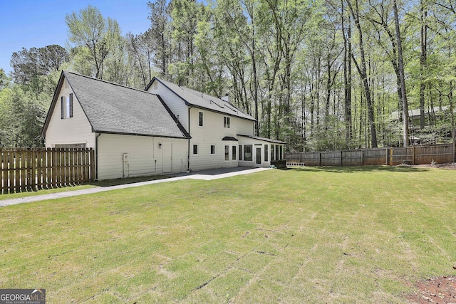 214 Windgate Ct, Peachtree City, GA 30269 - back of house with a patio, a fenced backyard, and roof with shingles