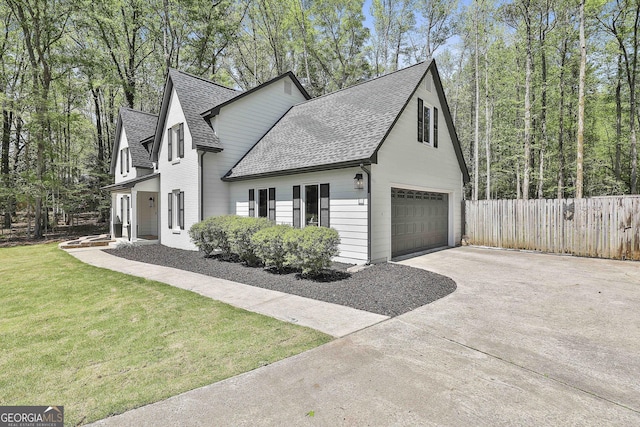 214 Windgate Ct, Peachtree City, GA 30269 - view of side of property featuring roof with shingles, driveway, and an attached garage