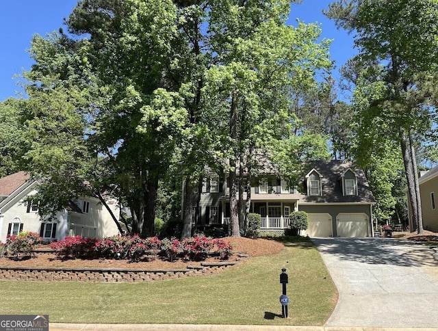 863 Fairwood Pointe NW, Acworth, GA 30101 - view of front of home featuring a porch, a garage, a front yard, and driveway