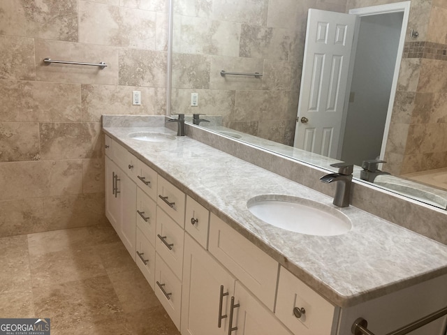 863 Fairwood Pointe NW, Acworth, GA 30101 - bathroom featuring a sink, double vanity, and tile walls