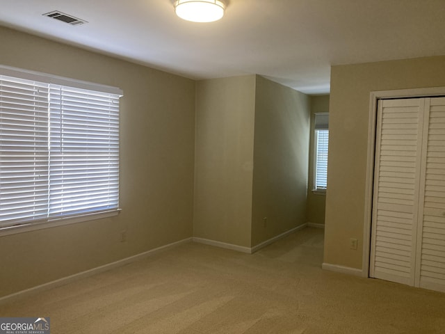863 Fairwood Pointe NW, Acworth, GA 30101 - unfurnished bedroom featuring a closet and light colored carpet