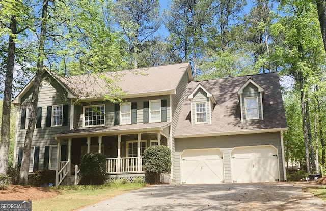 863 Fairwood Pointe NW, Acworth, GA 30101 - view of front facade with a porch, roof with shingles, a garage, and aphalt driveway