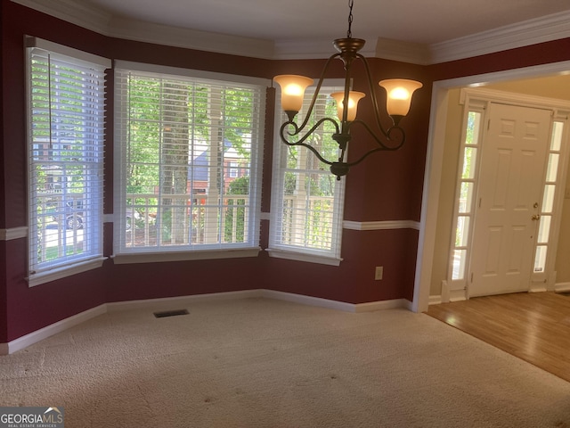 863 Fairwood Pointe NW, Acworth, GA 30101 - carpeted entryway with baseboards, a notable chandelier, ornamental molding, and visible vents