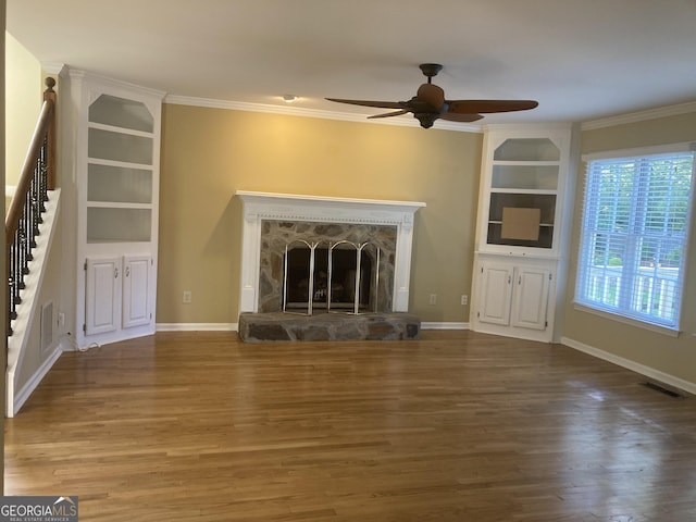 863 Fairwood Pointe NW, Acworth, GA 30101 - unfurnished living room featuring stairway, crown molding, a ceiling fan, and visible vents
