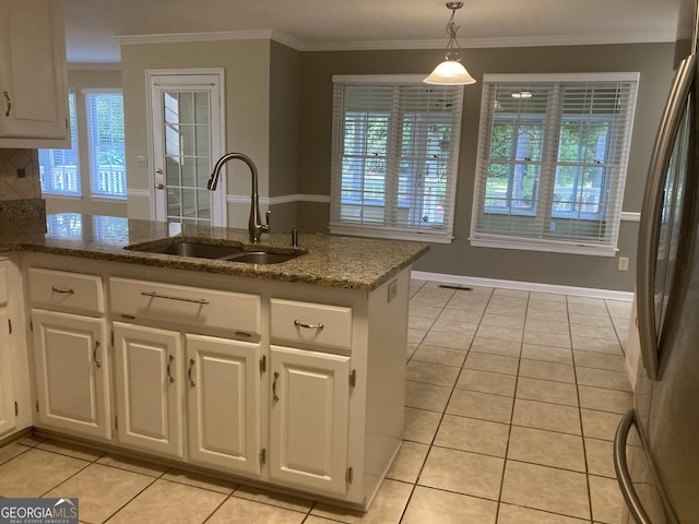 863 Fairwood Pointe NW, Acworth, GA 30101 - kitchen with a sink, freestanding refrigerator, light tile patterned floors, and white cabinets