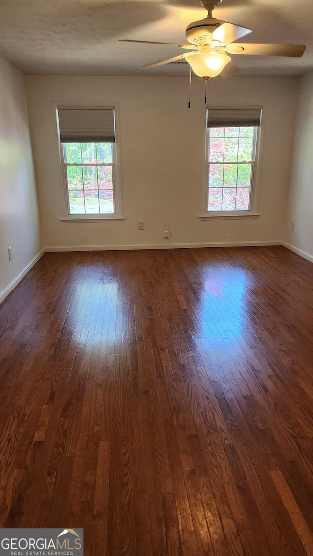 985 Lake Haven Ct, Roswell, GA 30076 - spare room with dark wood-type flooring, a wealth of natural light, and ceiling fan