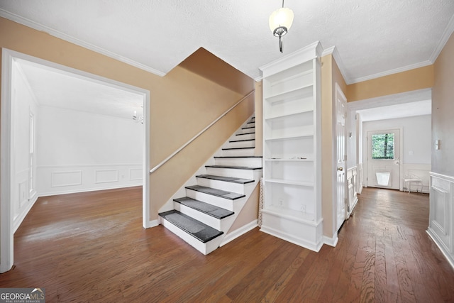 985 Lake Haven Ct, Roswell, GA 30076 - stairway featuring crown molding, a wainscoted wall, a decorative wall, and wood finished floors