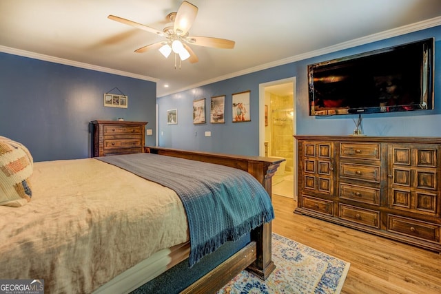 bedroom with wood finished floors, crown molding, a ceiling fan, and ensuite bathroom