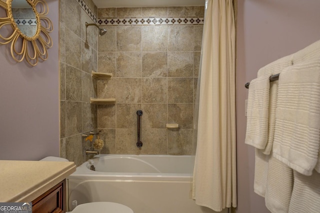 bathroom featuring toilet, vanity, and shower / bathtub combination with curtain