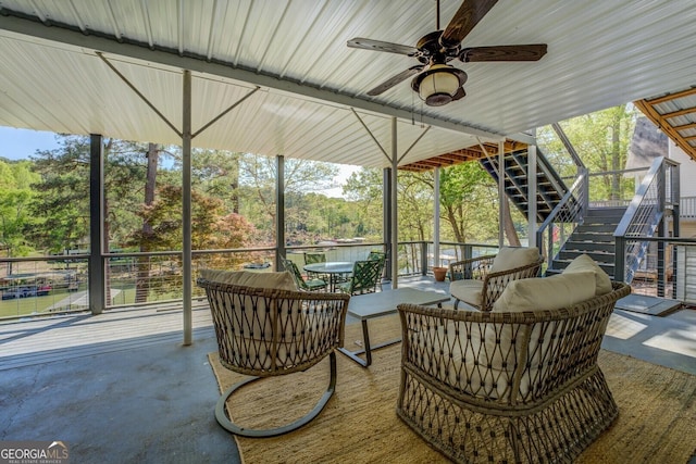 exterior space featuring outdoor lounge area, a ceiling fan, and stairs