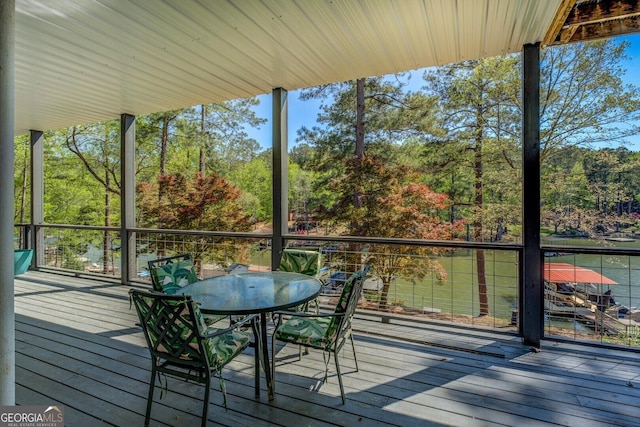 wooden deck featuring outdoor dining area