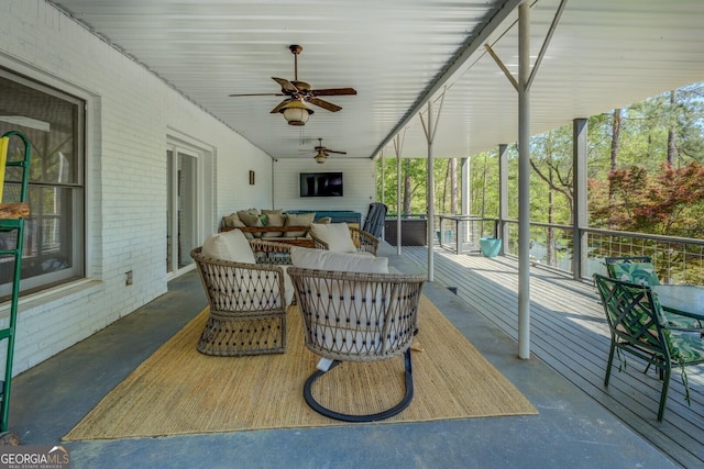 exterior space with an outdoor hangout area and a ceiling fan