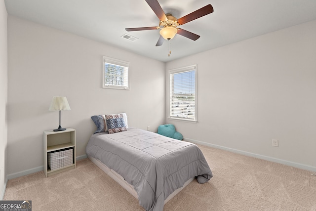 bedroom featuring carpet, visible vents, a ceiling fan, and baseboards