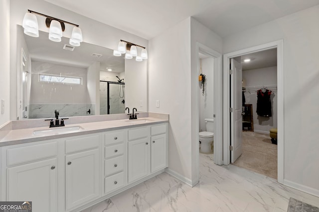 bathroom featuring visible vents, a stall shower, toilet, and a sink