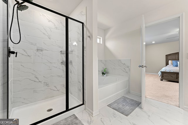 ensuite bathroom featuring a stall shower, a garden tub, connected bathroom, and marble finish floor