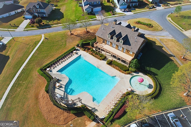 birds eye view of property with a residential view