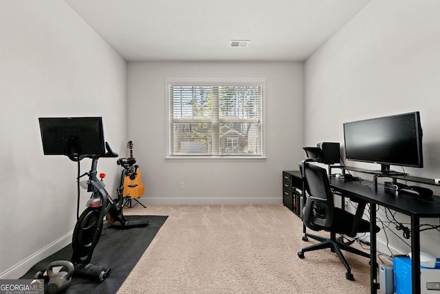 office area featuring carpet flooring, visible vents, and baseboards