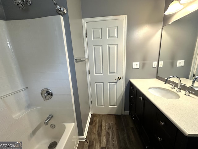 4254 Wood Cove Dr, Snellville, GA 30039 - full bathroom with vanity, baseboards, shower / bathing tub combination, and wood finished floors