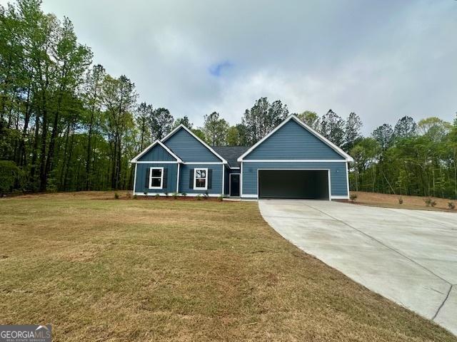 302 Lakeside Dr Lot 74, Lagrange, GA 30240 - view of front facade with a front yard, driveway, and an attached garage