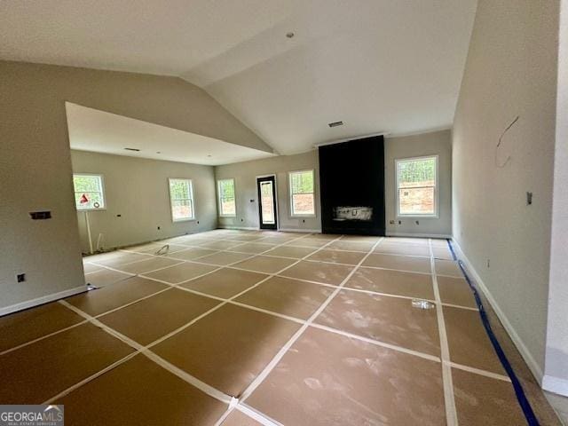 302 Lakeside Dr Lot 74, Lagrange, GA 30240 - unfurnished living room with baseboards and vaulted ceiling
