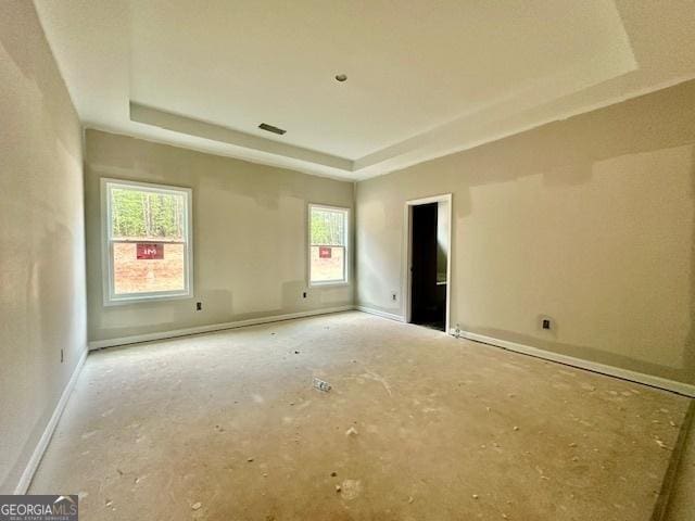 302 Lakeside Dr Lot 74, Lagrange, GA 30240 - unfurnished room with visible vents, plenty of natural light, a tray ceiling, and baseboards