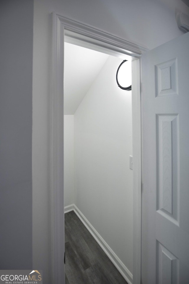 details featuring baseboards and wood finished floors